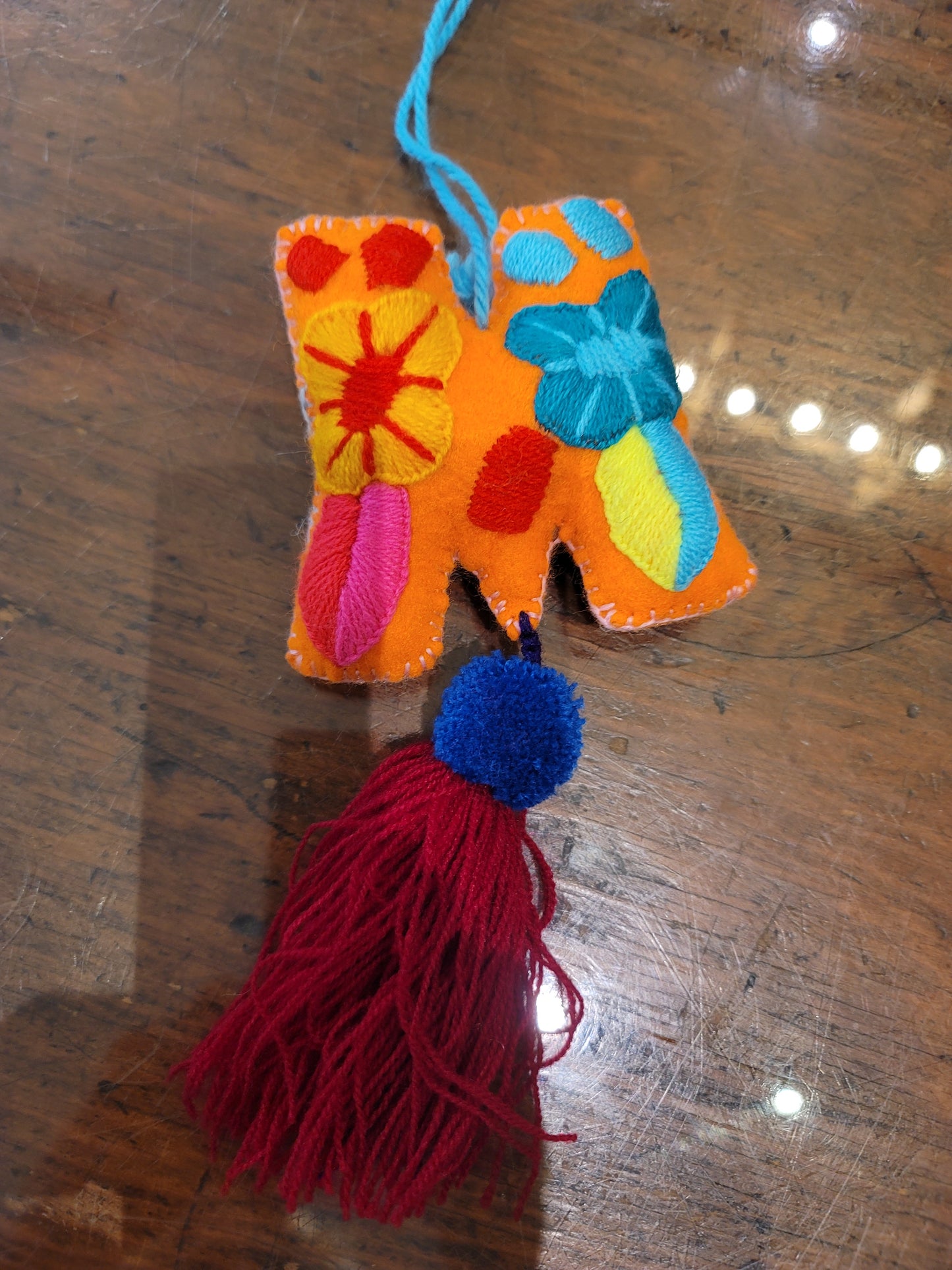 FELT INITIAL WITH TASSEL