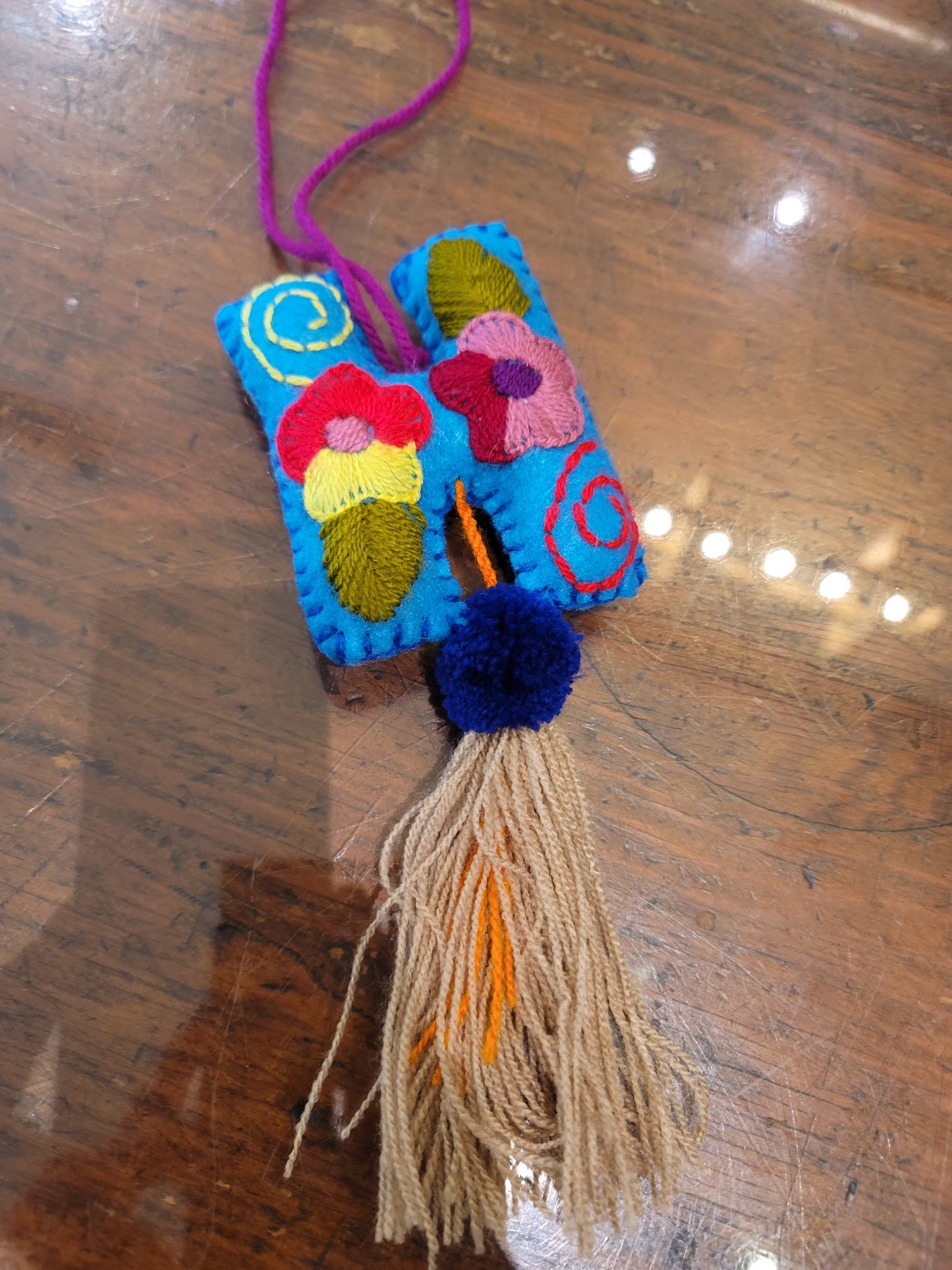 FELT INITIAL WITH TASSEL