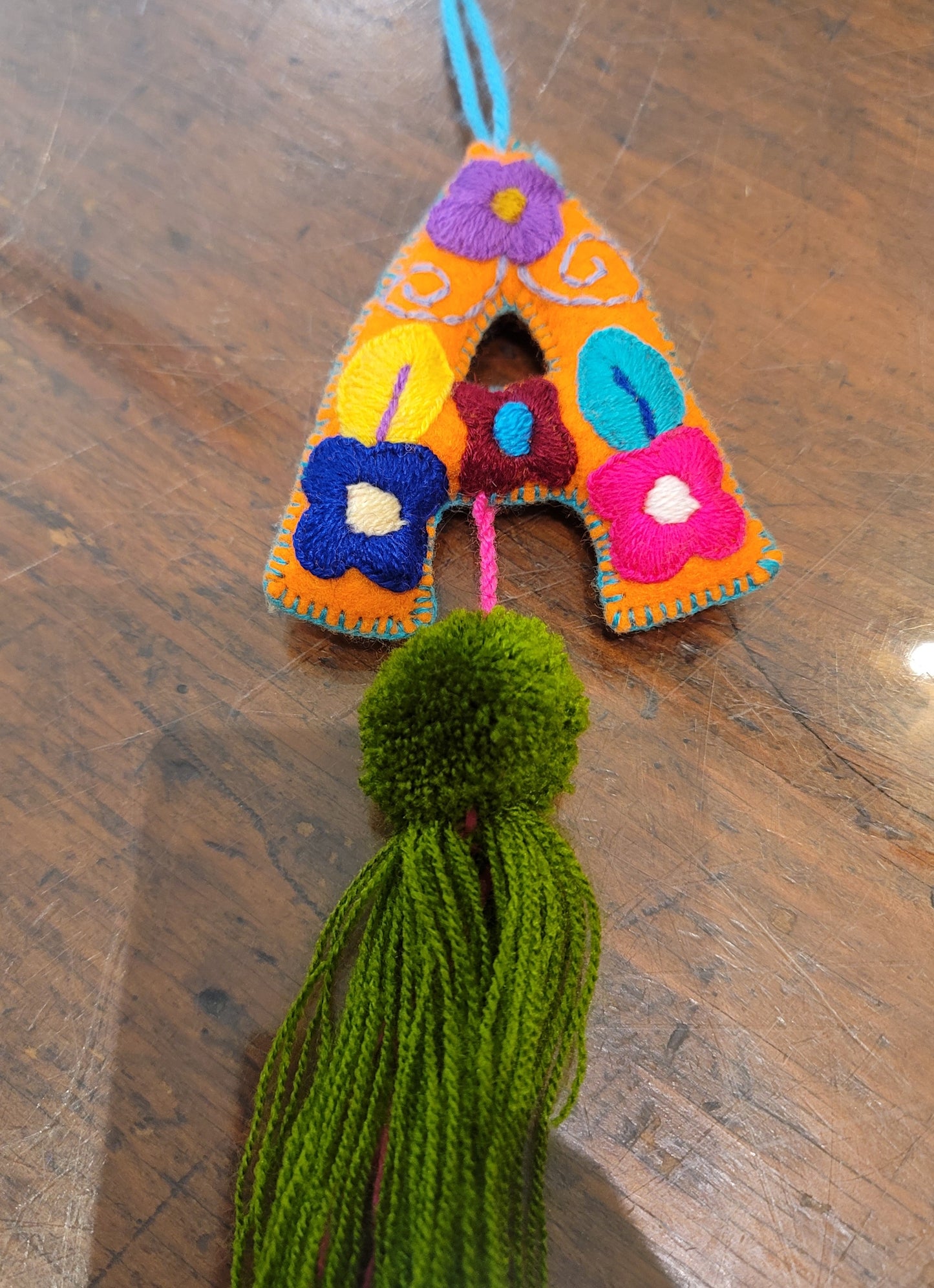 FELT INITIAL WITH TASSEL
